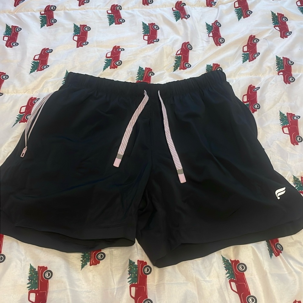 2 pairs of Fabletics lined men’s workout shorts